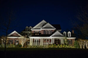 aqua-bright home decorated with christmas lights, illuminated after dark